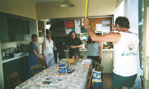 Stephen raises cane at the 607 Kitchen table (July, 2004)